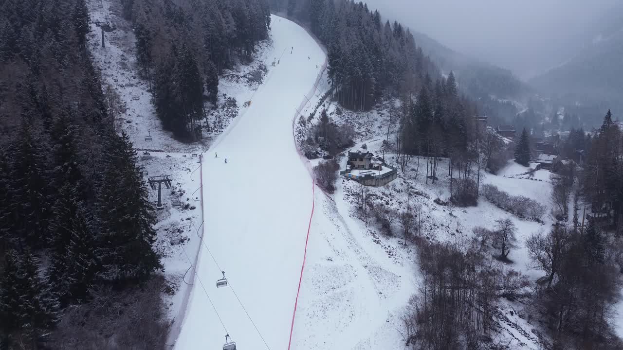 This is a large ski area that prepares Cortina 2026 in Italy. The locations are captured with a drone that shows the beauty of winter sports that combine blue sky, white snow and lovely