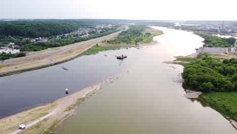 barge with industrial equiptment at conjuction of nemunas and neris river