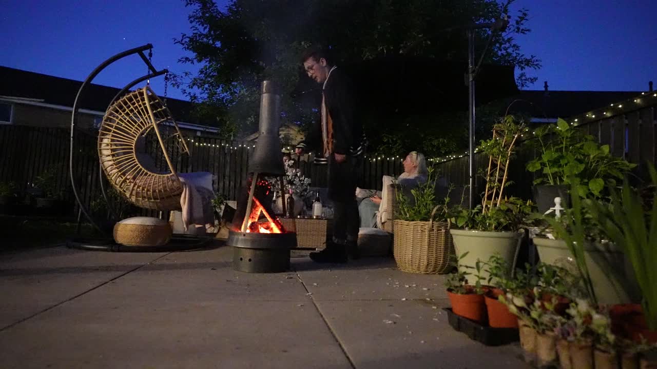 Smokey garden firepit, family evening social gathering, patio plants