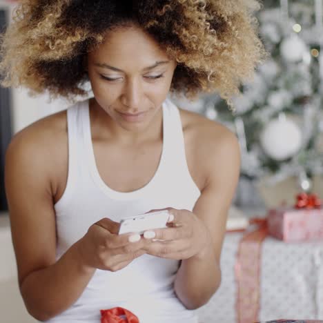 Serious-woman-checking-for-Christmas-messages