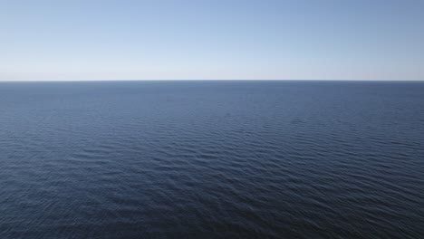 deep blue ocean water ripples from currents and wind blowing across, empty nature background