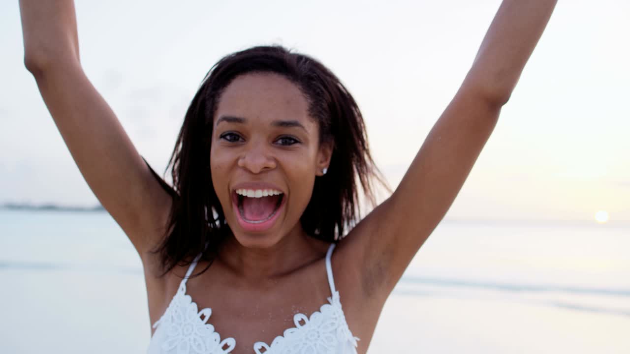 Portrait of African American girl on ocean beach