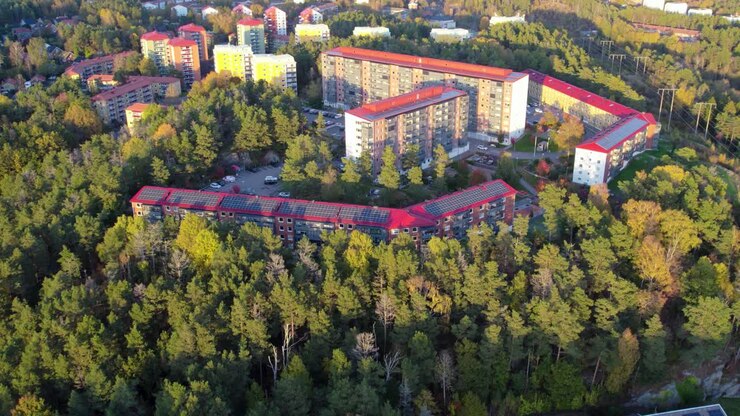 Aerial: Fastlagsgatan apartment block in Kortedala district during the day in Gothenburg, Sweden, orbit drone shot