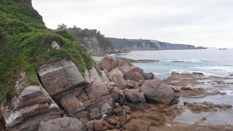 Aerial-shot-of-a-beautiful-scenic-rocky-beach