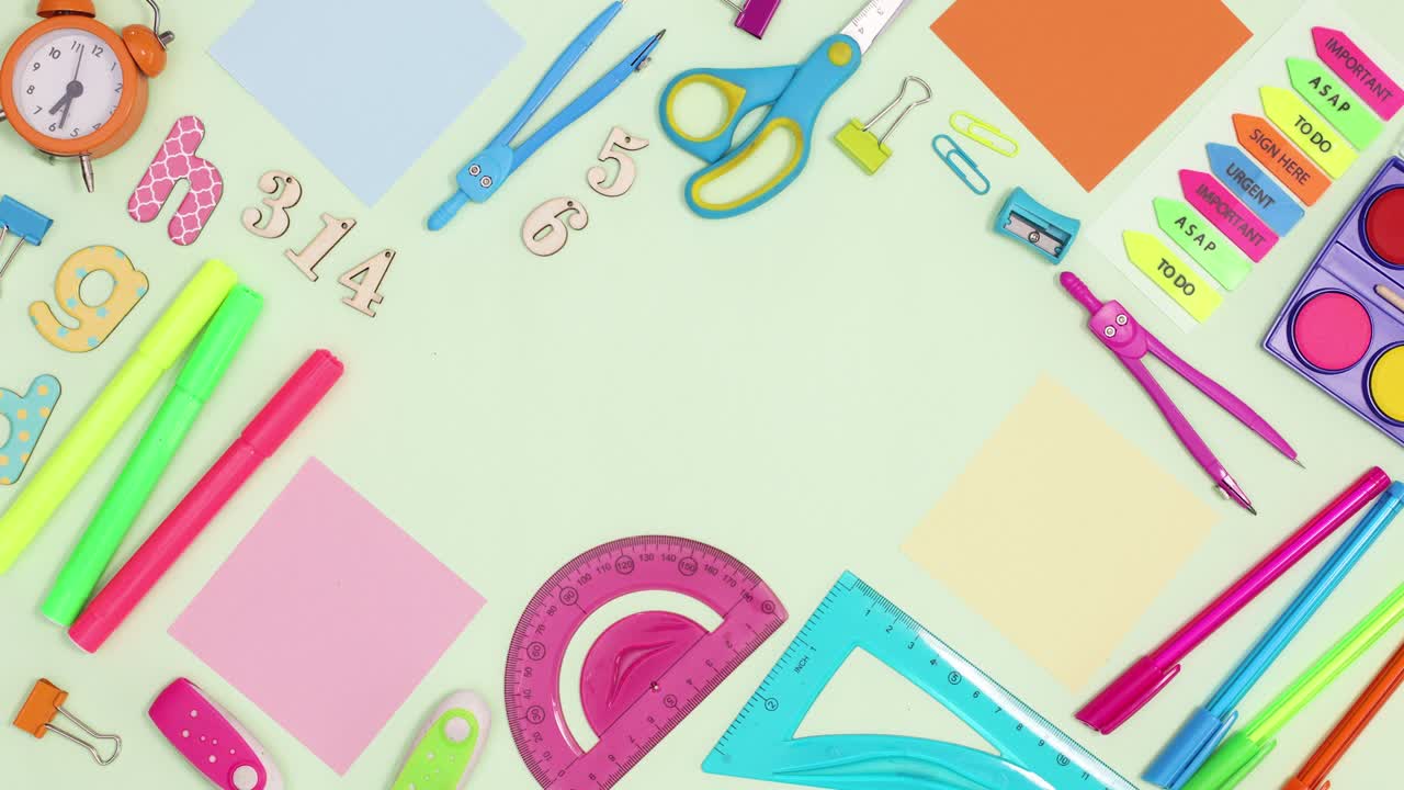 School frame made of writing stationery move on green theme with copy space. Stop motion