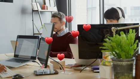 animation of falling hearts over diverse group of business people