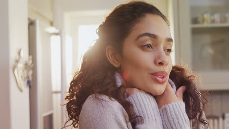 woman wearing winter cloths standing in kitchen feeling cold 4k 4k
