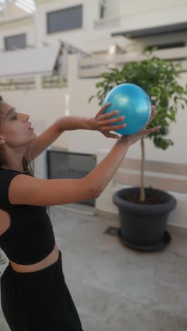 woman playing with ball outdoors