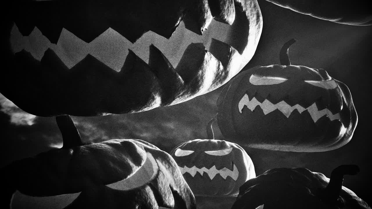 Scary Jack-o'-lanterns Floating in a Dark, Grainy Black and White Scene