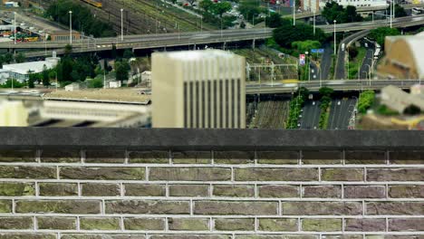 animation of brick wall over busy city