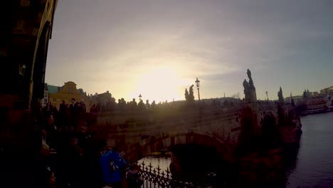 prague, pan over charles bridge and moldavia to the castle hradschin at sunset