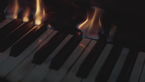piano keys melt as flames rise from underneath