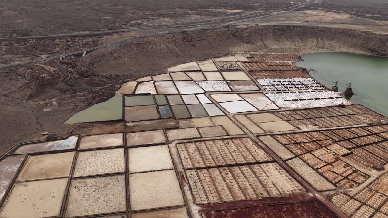 Aerial view of Janubio salt flats, showcasing vast geometric salt ponds