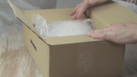 packing a box with bubble wrap