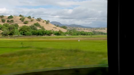 rural farming countryside landscape view of crop fields and rice paddies in the districts of timor-leste, southeast asia, passing views from car window