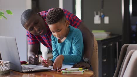 video of african american father helping son in homework