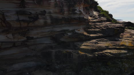 drone skimming rocks then ascending to ocean views ocean and sea stock videos