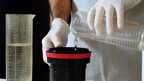 male photographer cleaning lens cover with liquid 4k