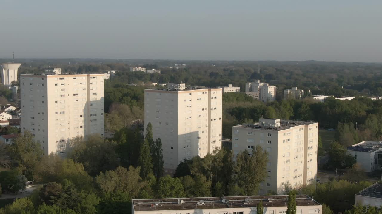 Expansive drone perspective over Nantes district featuring multiple residential high-rise buildings. Urban landscape for travel or city intros, France