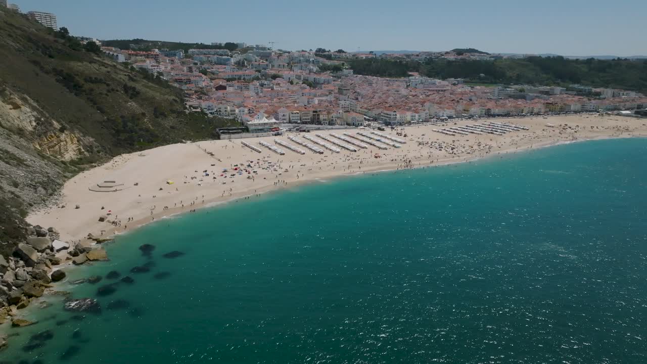 Drone shot of Nazar&eacute; from the sea to the beach and finished in the city