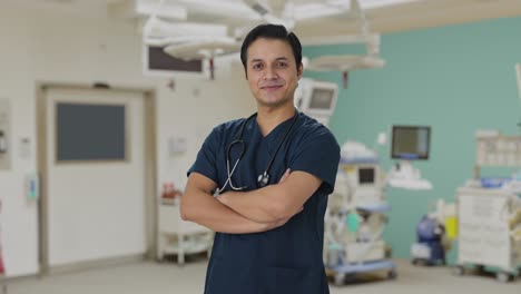 Portrait-of-Happy-Indian-doctor-standing-crossed-hands