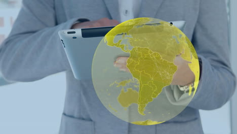 animation of yellow globe and data processing, over businessman using tablet