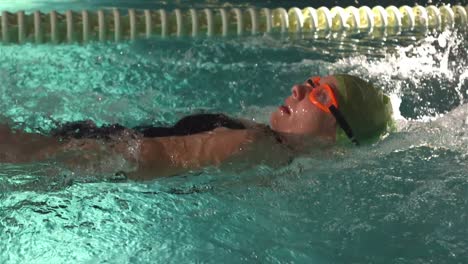 fit woman swimming in the pool