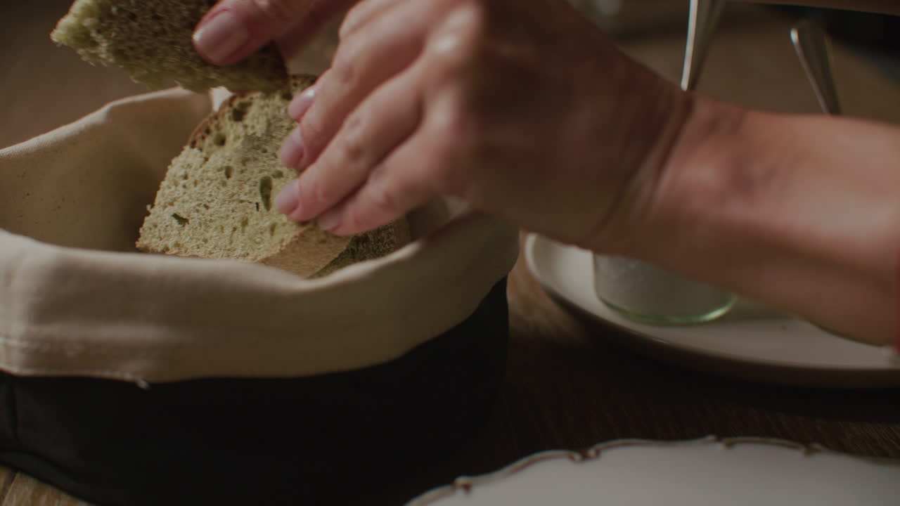 Person Serving Bread with Olive Oil
