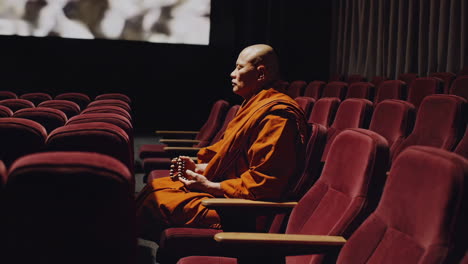 monk watching a movie