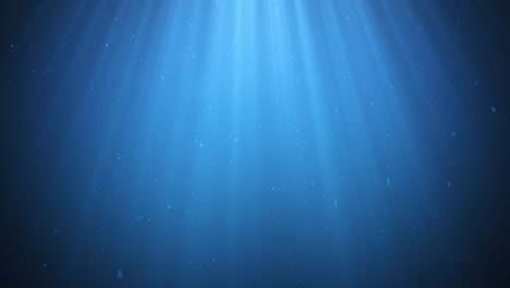 los rayos de luz solar que brillan desde arriba penetran en el agua azul clara profunda. los haces de luz solar bajo el agua. las pequeñas burbujas se mueven hacia arriba, debajo de la superficie del agua. animación 3d con bucle sin costuras. 4k