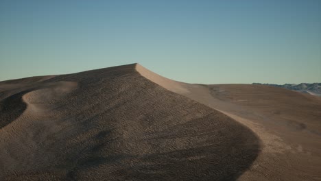 aerial view on big sand dunes in sahara desert at sunrise