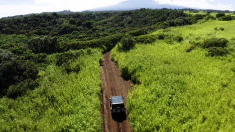 aerial view of a jeep climbing a mountain in maui, hawaii.