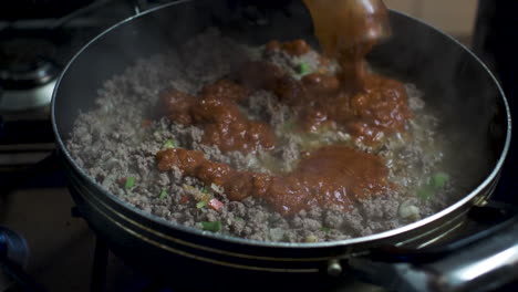 Tomato-Sauce-Being-Added-to-Sizzling-Mince-Meat