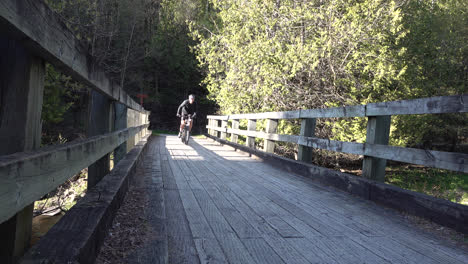 cyclist passing by on a bridge