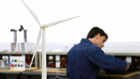 Windmill-and-digital-tablet-on-a-table-4k