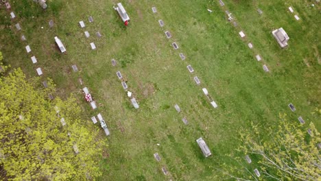 cemetery graveyard drone aerial footage grand rapids michigan with green foliage and trees and gravestones