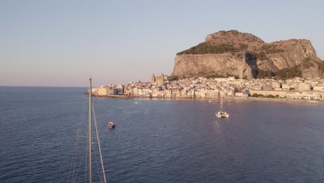 aerial drone view of the famous celafu medieval old town in sicily, italy