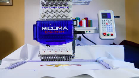 tailor sews on sewing machine