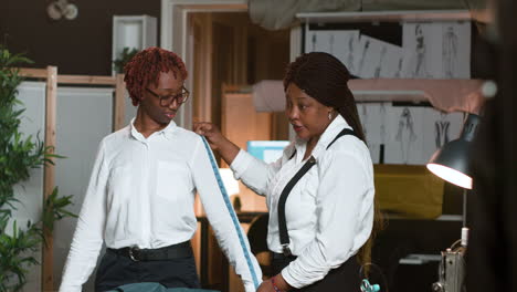 client posing for the tailor