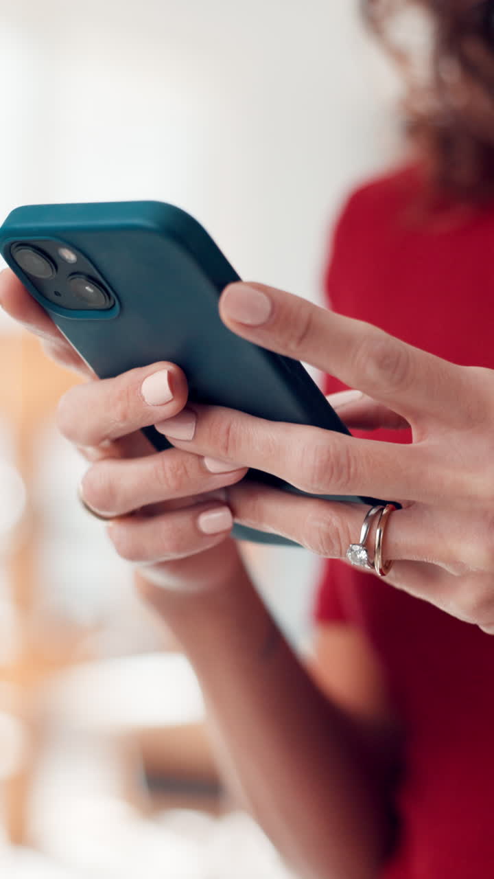 Close-Up of Woman's Hands Typing on a Smartphone