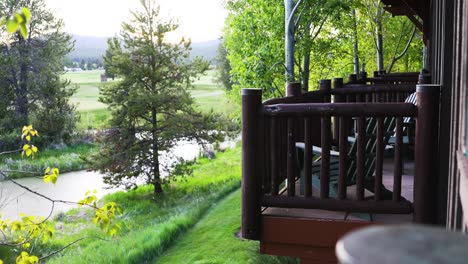 wooden porch of a cottage by the river in summer at countryside