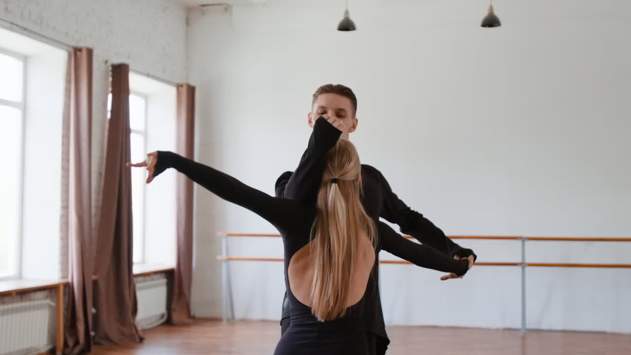 Professional Dancers Practicing Ballroom Dance in a Studio