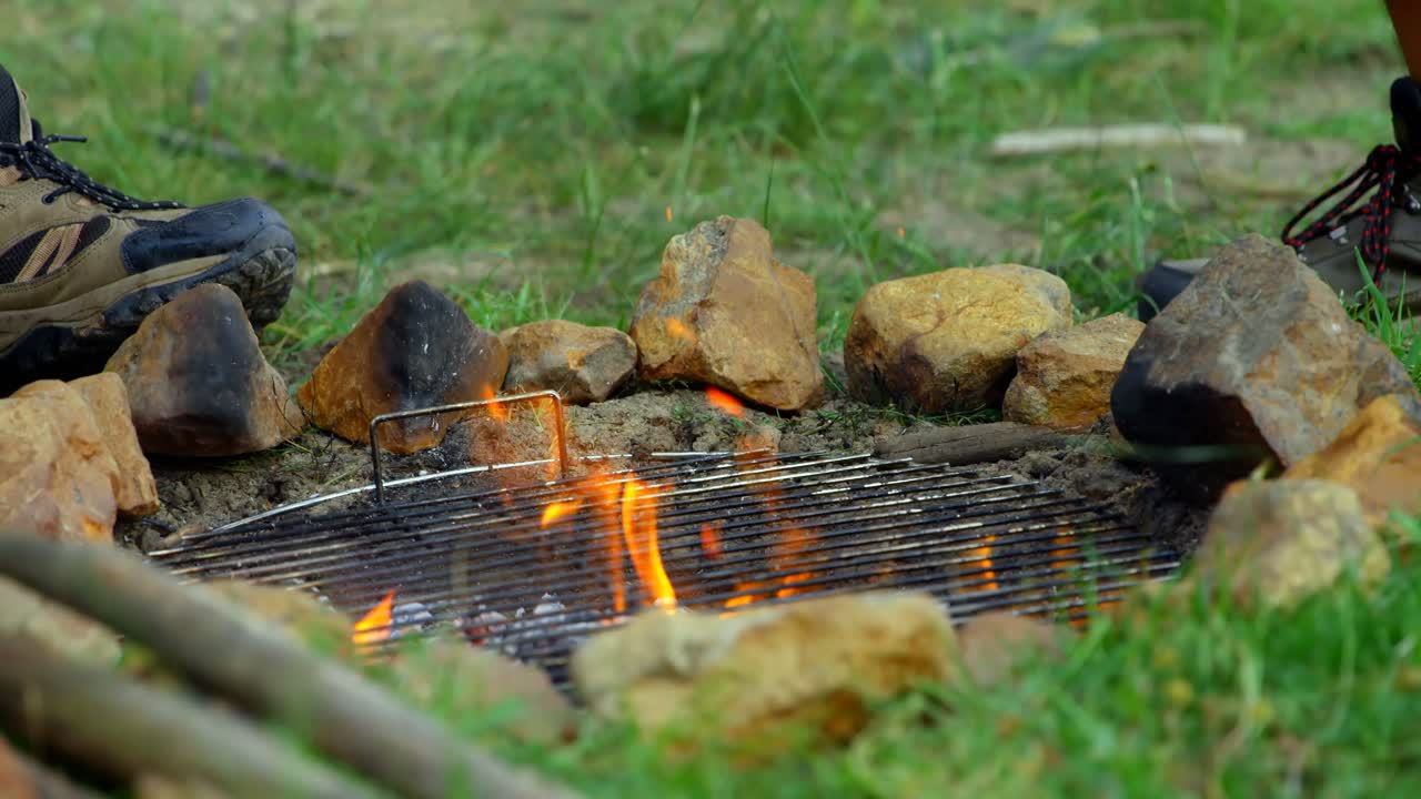 Close-up of campfire at campsite 4k