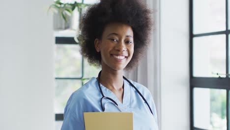 portrait of smiling african american female doctor with stethoscope on the neck