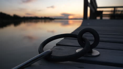 detail shot of mooring ring at harbour in archipelago of turku, finland, at sunset