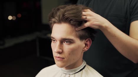 close-up-portrait-of-styling-male-hairstyle-with-long-hair