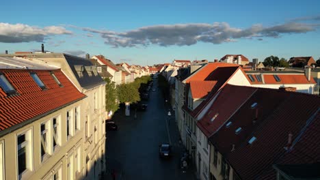 car drives along cobblestone road gorgeous aerial view