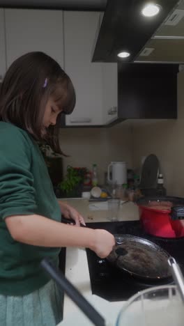 young girl cooking in the kitchen