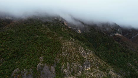 High-Mountains-in-Clouds-and-Fog,-Enigmatic-Beauty-of-the-Seasonal-Wilderness-of-Mystical-Autumn