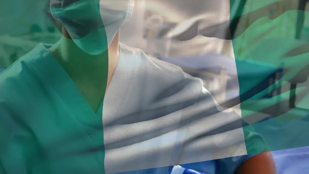 Bandiera della Nigeria che sventola sullo sfondo di un'operatrice sanitaria donna caucasica con mascherina in ospedale